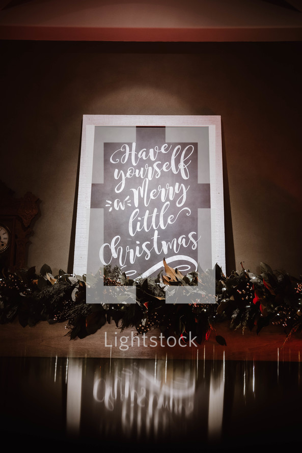 Have Yourself a Merry Little Christmas sign over a mantle 