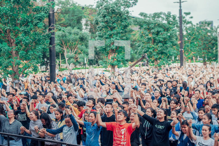 Hands raised during a worship service 