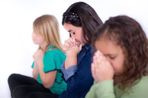 Girls praying.