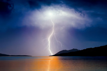 lightning strike over the ocean 