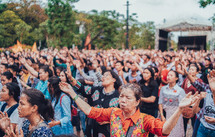 hands raised during a worship serivce 