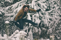 man leaping in the snow