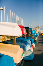 rowboats stored on a shore 