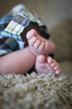 Newborn baby boy feet.