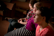 teens sitting in a church pew