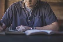 A man taking notes at a Bible study