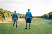 two men on a golf course 