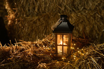 lantern on a hay bale 