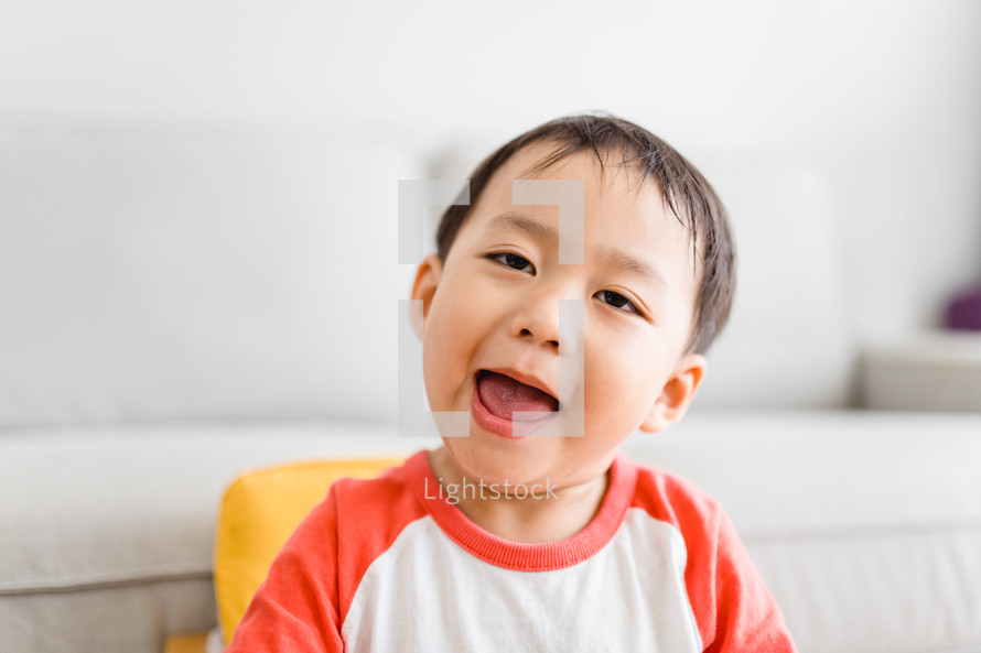 toddler boy making a silly face 