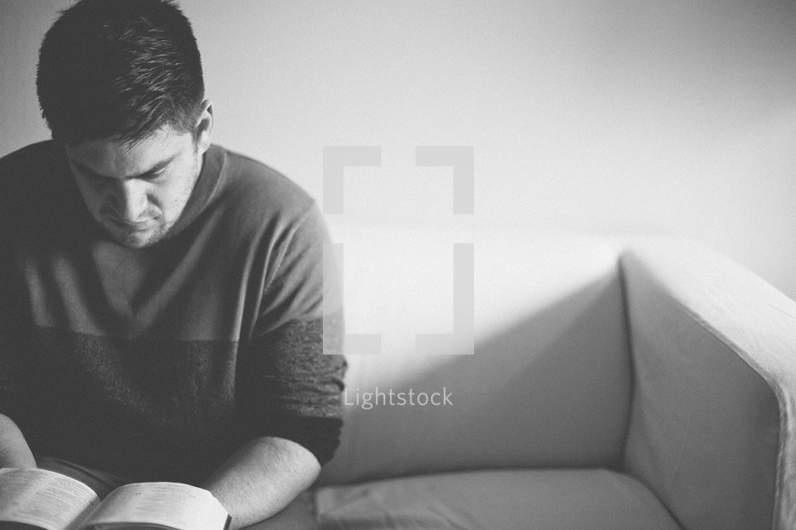 A man reading a Bible