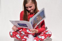 a child reading a children's book about the birth of Christ 