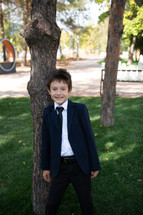 portrait of a boy in dress clothes 