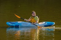 Fifteen year old girl in kayak on City Lake, Albemarle, North Carolina 