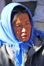 woman with a scarf over her head