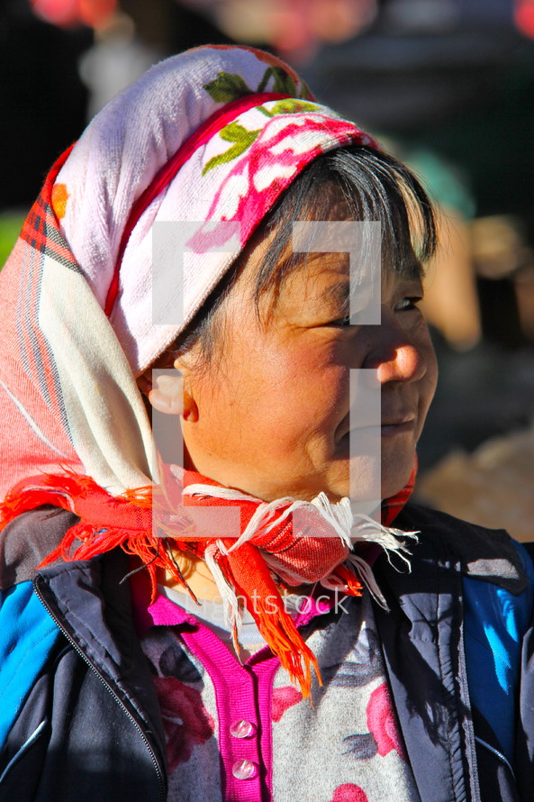 Woman in traditional Chinese minority tribal head covering