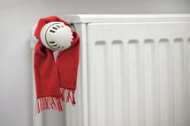White radiator with red scarf