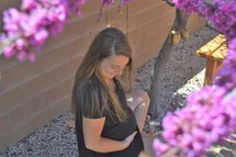 pregnant woman and pink flower 