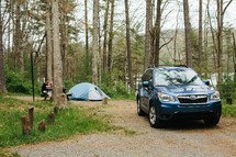 SUV and tent at a campgrounds 