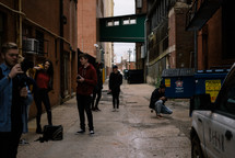 friends standing in an alley 