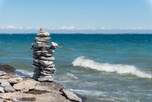 stacked stones on a shore 