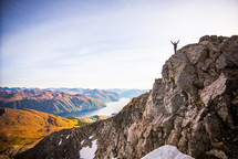 man standing on a mountaintop 