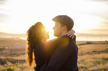 couple hugging outdoors and intense sunlight 