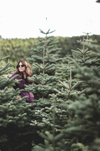 a woman at a Christmas tree farm 