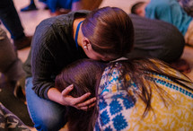 hugs and tears during a worship service 