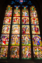 An elaborate stained glass church window.