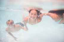 kids swimming under water 