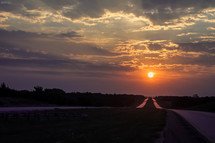 stretch of highway at sunset 