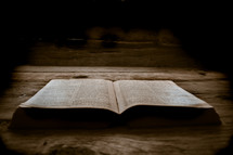 open Bible on wood boards 