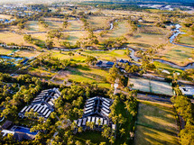 aerial view over condos and golf course 