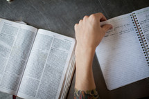 an open Bible and journal at a Bible study 