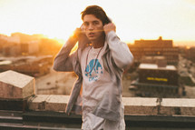 young man removing his hoodie under sunlight