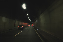 cars driving through tunnels 