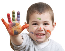 toddler boy with paint on his hands 