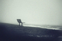 park bench by a shore 