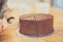 cutting a chocolate cake 