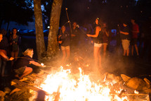 roasting marshmallows around a fire 