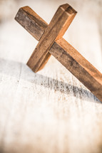wooden cross on white wood 