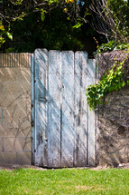 Wood gate in a stone wall.