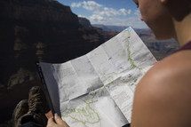 woman looking at a trail map 