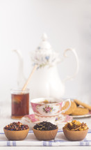 Loose Leaf Tea in a Wooden Bowls, tea pots, and honey 