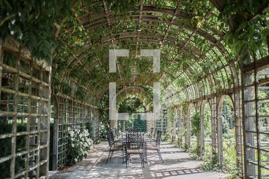 outdoor seating under an arbor 