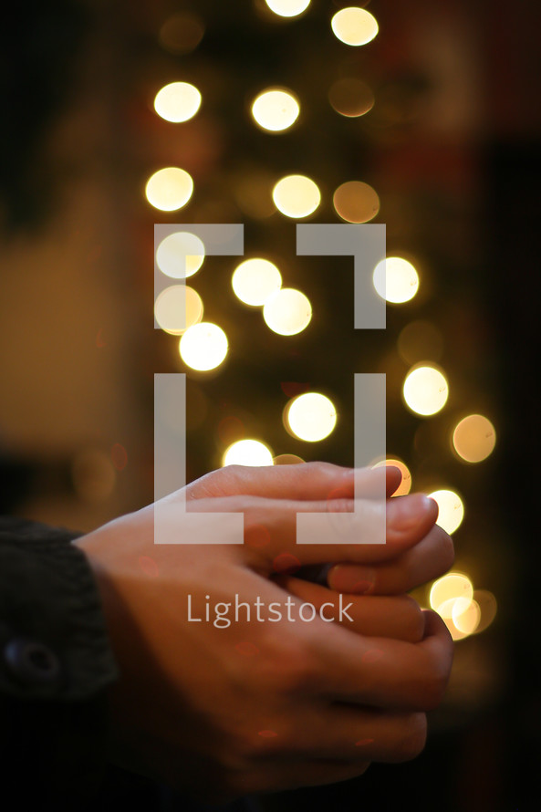 prayer hands with christmas lights