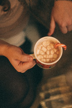 woman holding a mug of hot chocolate 