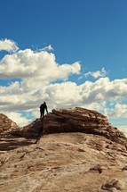 man climbing on a rock in Nevada