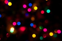 Colored Christmas lights at night.
