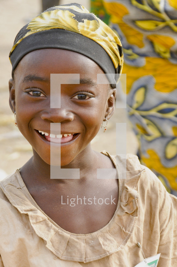 Smiling girl child in a hat